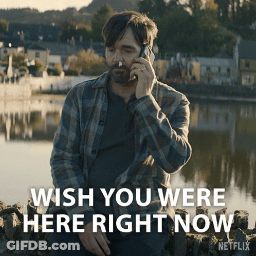 A Man Talking On A Cell Phone With The Words Wish You Were Here Right Now On The Bottom GIF