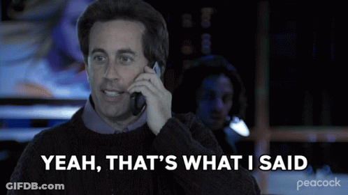 A Man Talking On A Cell Phone With The Words Yeah That 'S What I Said Behind Him GIF