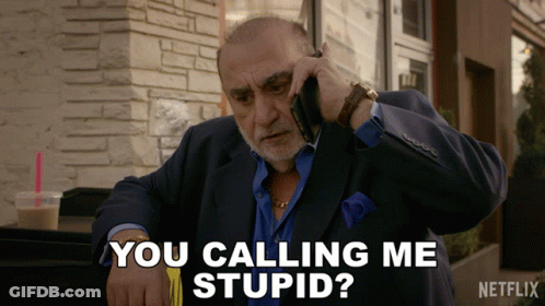 A Man Talking On A Cell Phone With The Words You Calling Me Stupid GIF