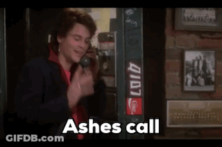 A Man Talking On A Phone With The Words " Ashes Call " Above Him GIF