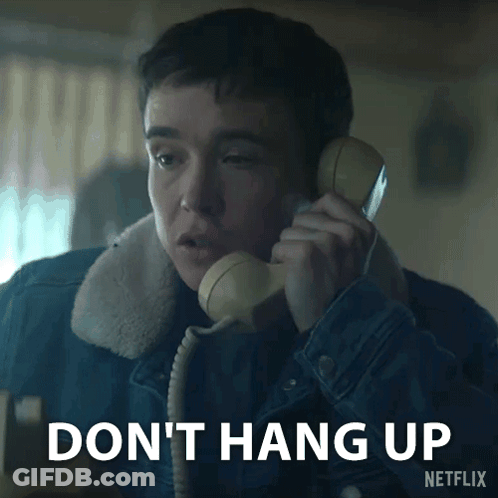 A Man Talking On A Phone With The Words " Do N't Hang Up " Written Below Him GIF