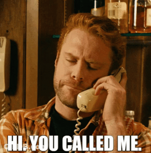 A Man Talking On A Phone With The Words Hi You Called Me GIF