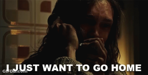 A Man Talking On A Phone With The Words " I Just Want To Go Home " Behind Him GIF