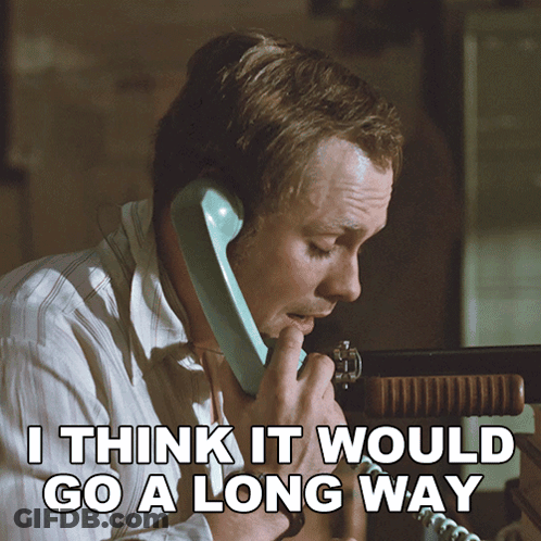 A Man Talking On A Phone With The Words " I Think It Would Go A Long Way " Above Him GIF