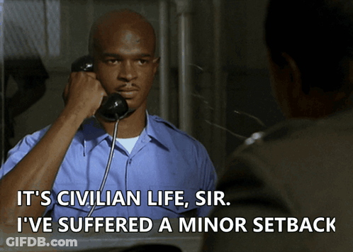 A Man Talking On A Phone With The Words " It 'S Civilian Life Sir I 'Ve Suffered A Minor Setback " GIF