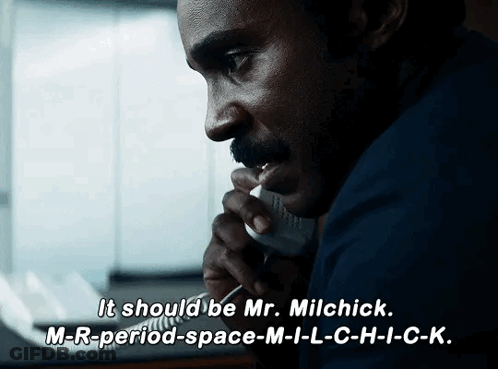 A Man Talking On A Phone With The Words " It Should Be Mr. Milchick " On The Bottom GIF