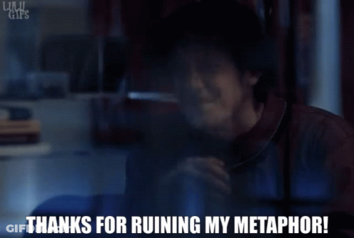 A Man Talking On A Phone With The Words " Thanks For Ruining My Metaphor " Written Below Him GIF