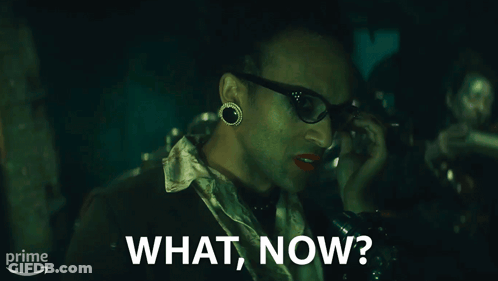 A Man Talking On A Phone With The Words What Now On The Bottom GIF