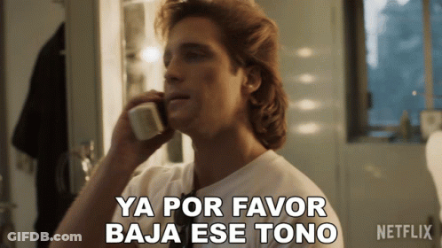 A Man Talking On A Phone With The Words Ya Por Favor Baja Ese Tono GIF