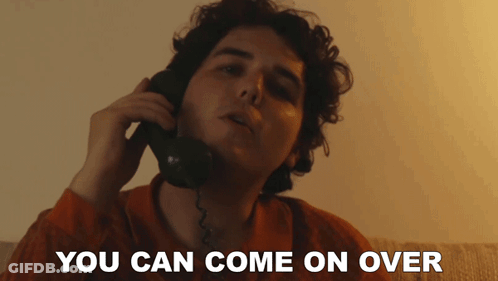 A Man Talking On A Phone With The Words " You Can Come On Over " Written Below Him GIF