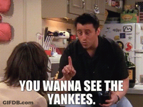 A Man Talking To A Woman In A Kitchen With The Words You Wanna See The Yankees On The Bottom GIF
