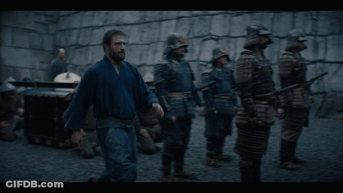 A Man Talking To A Woman With The Words Peering Into Ladies Private Quarters Below Him GIF