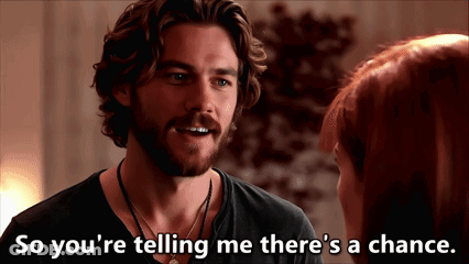 A Man Talking To A Woman With The Words So You 'Re Telling Me There 'S A Chance Written Below Him GIF