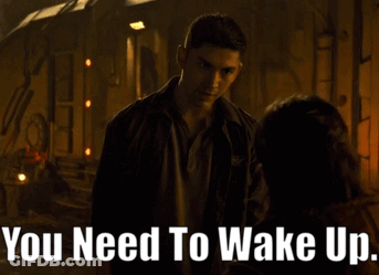 A Man Talking To A Woman With The Words " You Need To Wake Up " On The Bottom GIF
