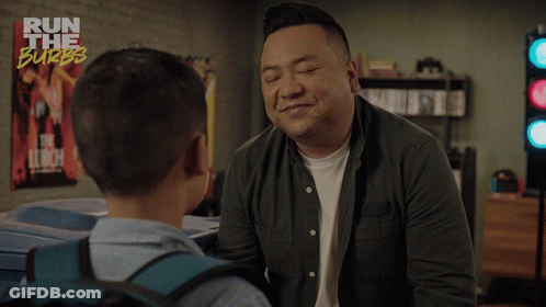 A Man Talking To A Young Boy With The Words " Life Is Hard " On The Bottom GIF