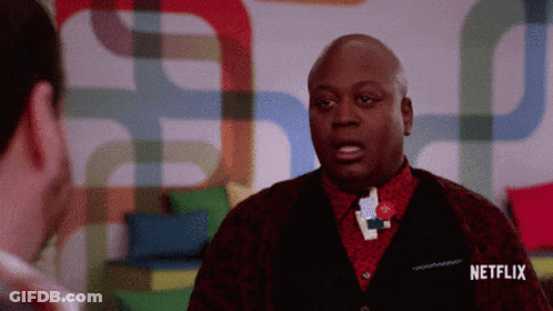 A Man Talking To Another Man With A Netflix Logo On The Bottom GIF