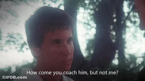 A Man Talking To Another Man With The Words " How Come You Coach Him But Not Me " Below Him GIF