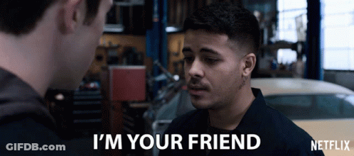 A Man Talking To Another Man With The Words " I 'M Your Friend " On The Screen GIF