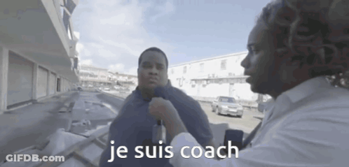A Man Talking To Another Man With The Words Je Suis Coach On The Bottom Right GIF