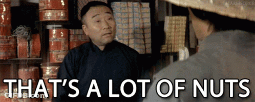 A Man Talking To Another Man With The Words That 'S A Lot Of Nuts Written Below Him GIF