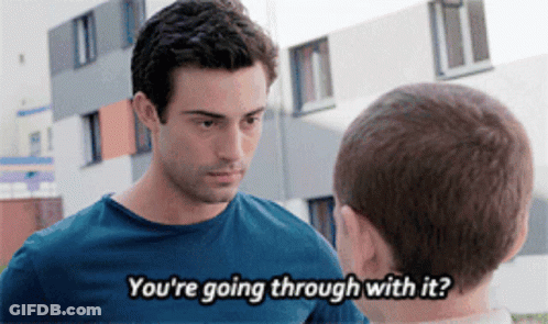A Man Talking To Another Man With The Words " You 'Re Going Through With It " Visible GIF