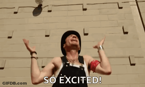 A Man Throws A Ball In The Air With The Words So Excited Behind Him GIF