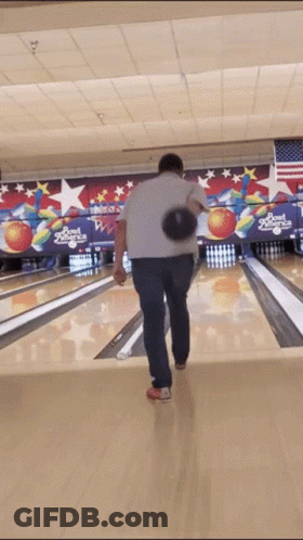 A Man Throws A Bowling Ball In A Bowling Alley That Says Bowl America On The Wall Behind Him GIF