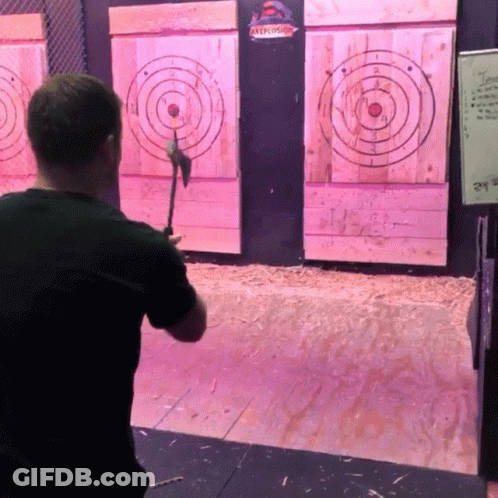 A Man Throws An Axe At A Target That Says " Axelot " On It GIF