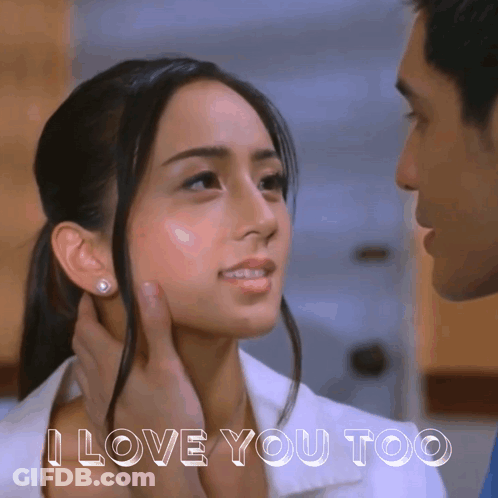 A Man Touching A Woman 'S Face With The Words I Love You Too Below GIF