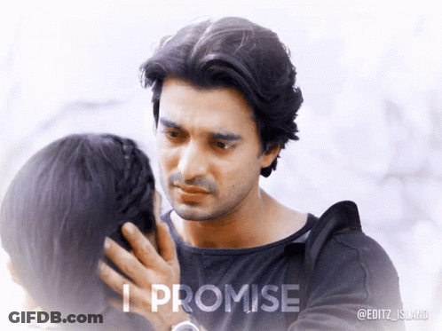 A Man Touching A Woman 'S Face With The Words " I Promise " Below Him GIF