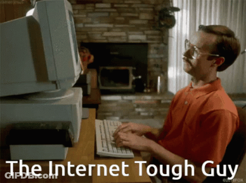 A Man Typing On A Keyboard With The Words " The Internet Tough Guy " Behind Him GIF
