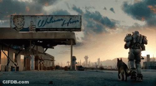 A Man Walking A Dog In Front Of A Building That Says Welcome Home GIF