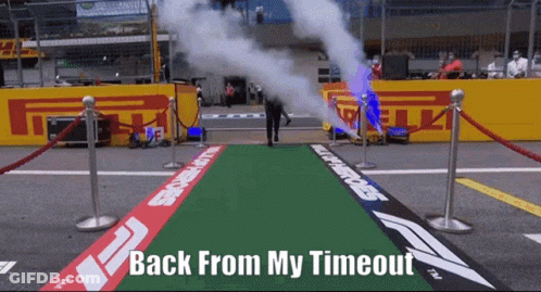 A Man Walking Down A Green Carpet With The Words Back From My Timeout On It GIF