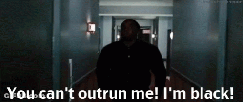 A Man Walking Down A Hallway With The Words " You Can 'T Outrun Me I 'M Black " On The Bottom GIF
