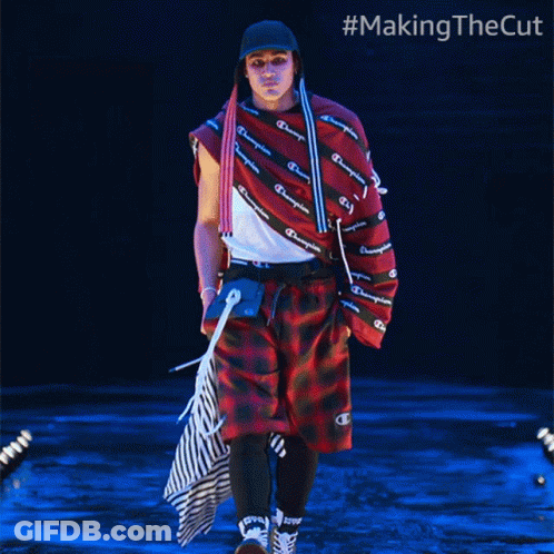 A Man Walking Down A Runway With #Makingthecut Written On The Bottom GIF