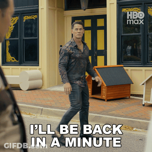 A Man Walking Down The Street With The Words " I 'Ll Be Back In A Minute " On The Bottom GIF