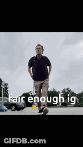 A Man Walking In A Parking Lot With The Words Fair Enough Ig Written On The Bottom GIF