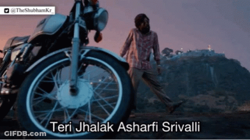 A Man Walking In Front Of A Motorcycle That Says Teri Jhalak Ashari Srivali GIF
