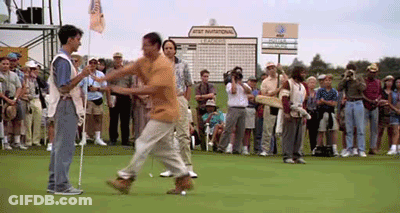 A Man Walking On A Golf Course With A Sign That Says At & T National GIF