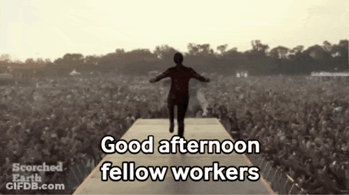 A Man Walking On A Stage With The Words Good Afternoon Fellow Workers GIF