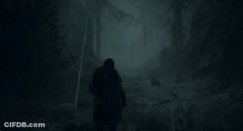 A Man Walking Through A Foggy Forest With A Backpack GIF