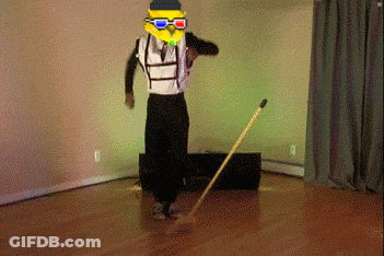 A Man Wearing 3D Glasses And A Yellow Mask Is Standing On A Wooden Floor GIF