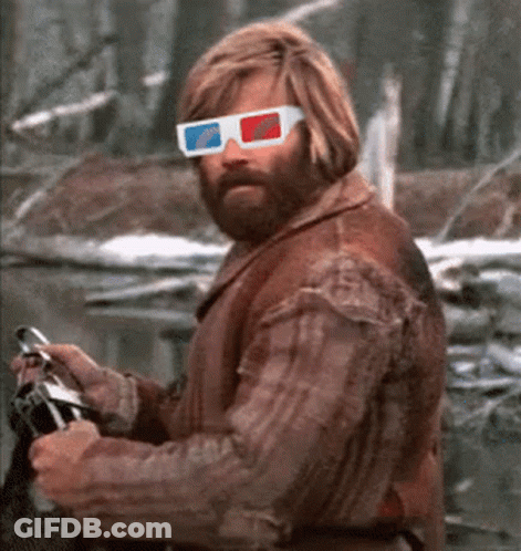 A Man Wearing 3D Glasses Is Holding A Camera GIF