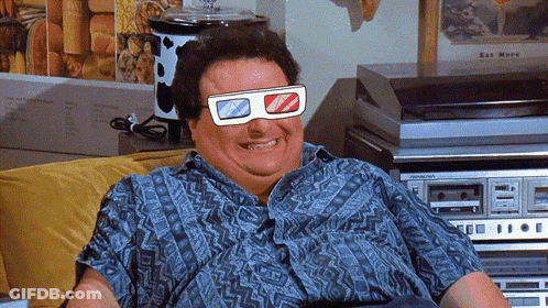A Man Wearing 3D Glasses Sits On A Couch In Front Of A Pioneer Stereo GIF