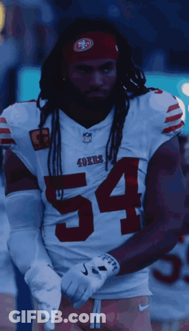 A Man Wearing A 49Ers Jersey With The Number 54 On The Front GIF