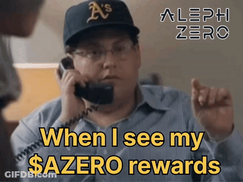 A Man Wearing A A 'S Hat Is Talking On A Phone GIF