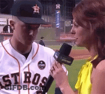 A Man Wearing A Astros Jersey Is Being Interviewed By A Woman GIF