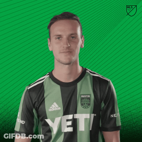 A Man Wearing A Austin Jersey Says Vamos On A Green Background GIF