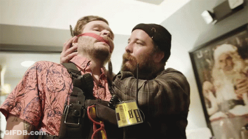 A Man Wearing A Badge That Says ' Ambulance ' On It GIF