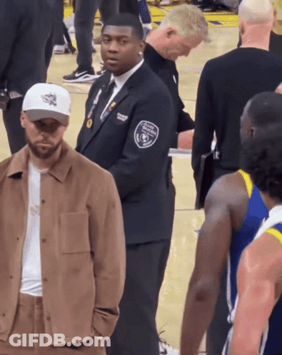 A Man Wearing A Badge That Says Security Guard On It GIF